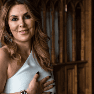 Anne-Marie smiling in a peaceful setting — trauma and relationship psychology coach training at Soul Awakening Academy.